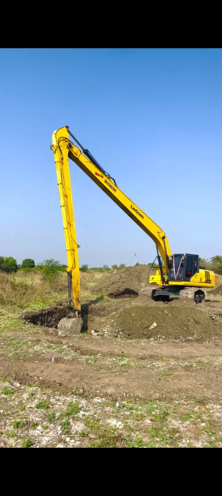 Heavy excavator machine used for well digging at a project site